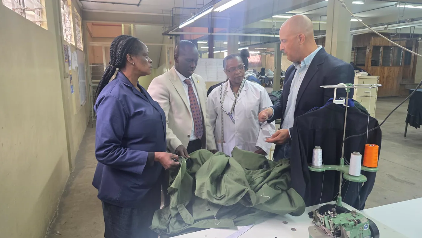 Andontech consultants reviewing production quality on a factory floor
